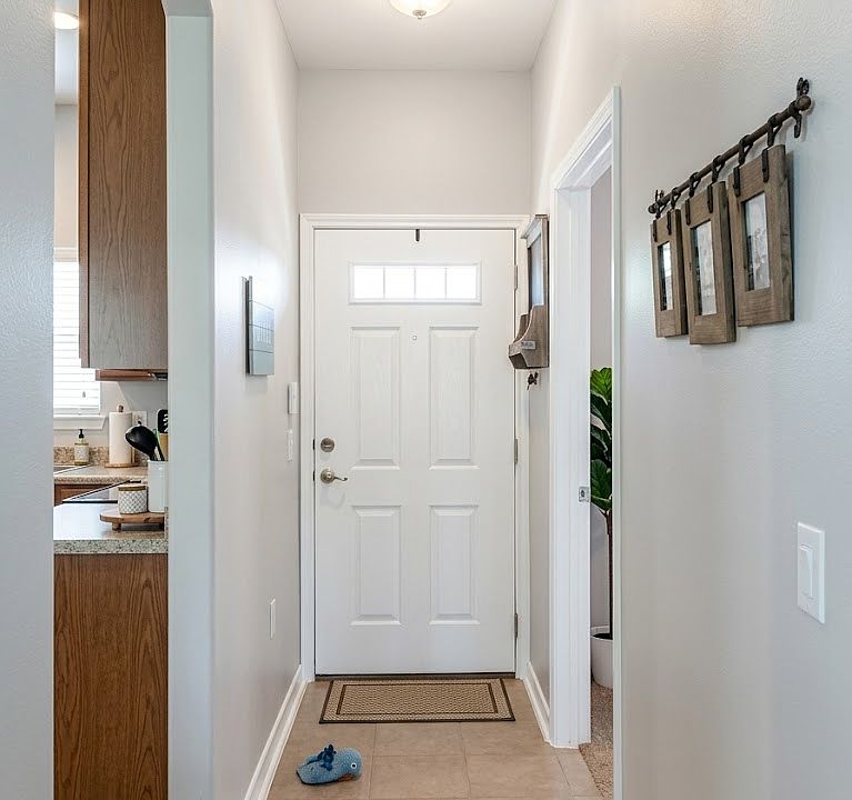 Front Entrance hallway. Kitchen on left, master on right.