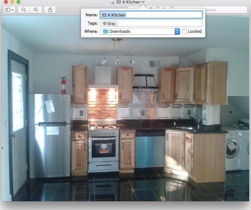 Kitchen with black granite tile, washer/dryer stainless stee