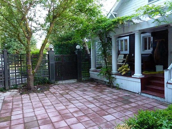 Backyard porch and patio. Fenced yard, perfect for dogs.