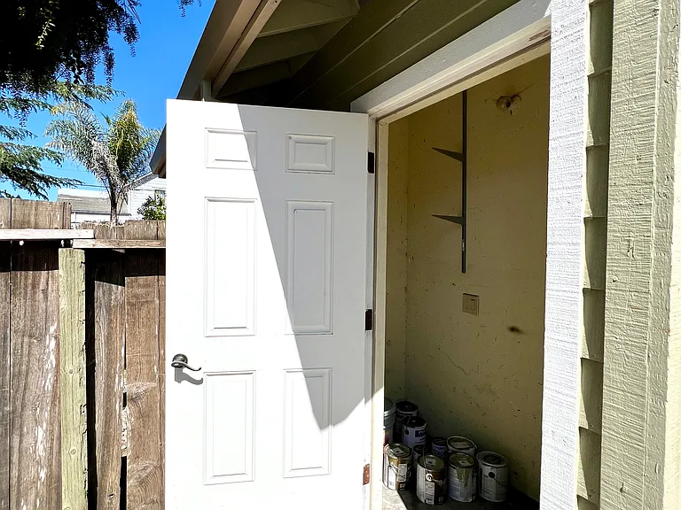 Exterior storage closet off backyard deck