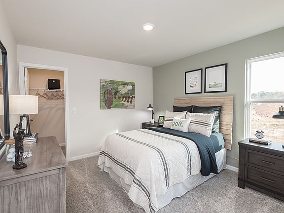 Take a look at this spacious bedroom featuring a private walk-in closet.