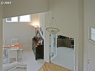 Vaulted entry leads to formal living area and office