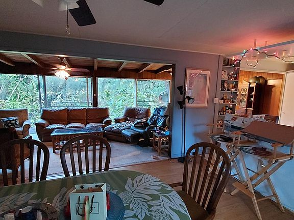large open floor plan, allows for up to six people to have plenty of space for private interests. Fan above dining table, has been replaced with a new large fan and light.