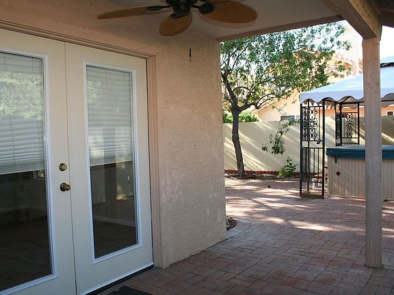 Covered Patio w Jacuzzi in background