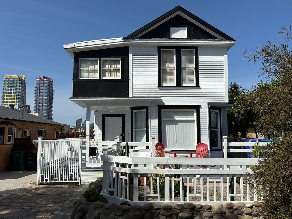 Front view of residence with down town towers in the background highlighting the residences close proximity to the night life.