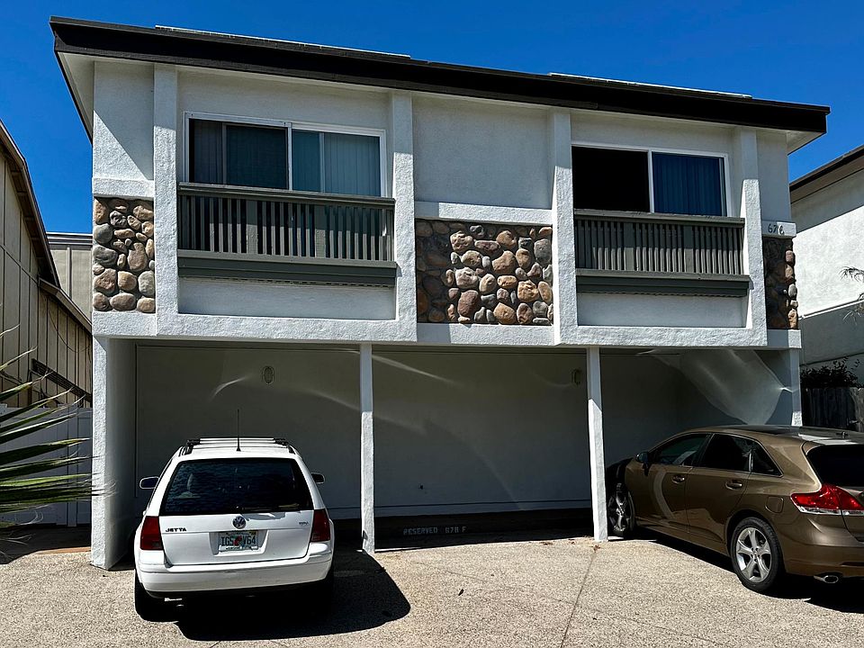 View of building from Seacoast Drive. Newly painted and reserved parking space at right.