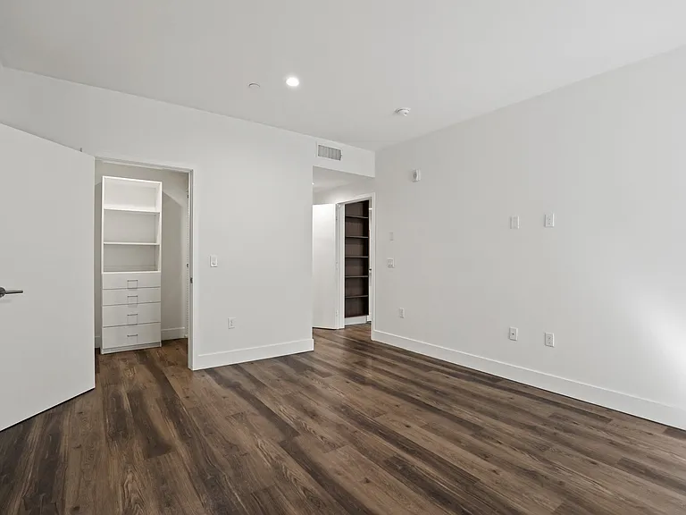 Bedroom with Walk-In Closet with Built-In Organizers