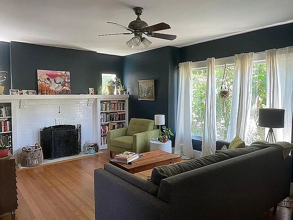 Large living room with hardwoods and lots of light