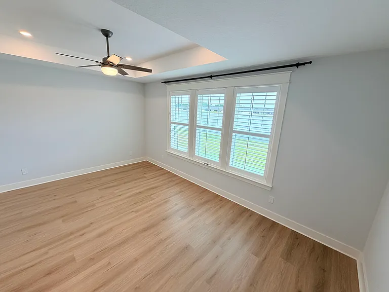 Spacious master bedroom with stunning water views