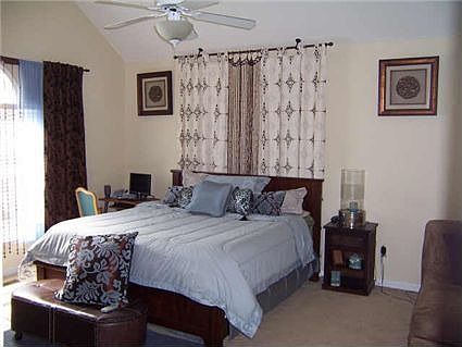 Large master bedroom has sitting area and large master bath.