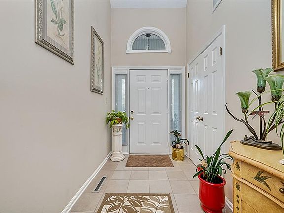 Beautiful foyer welcomes guests into this well-maintained home.