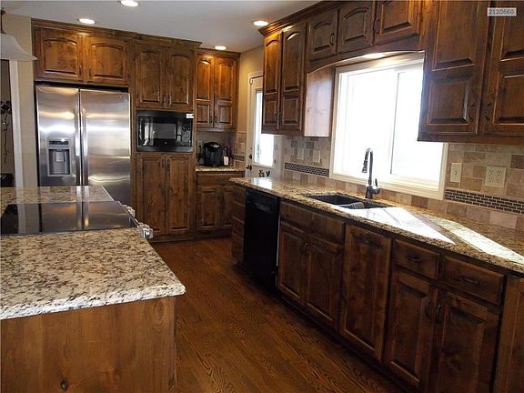 Under Mount Sink with Up-graded Faucet and view of back yard.