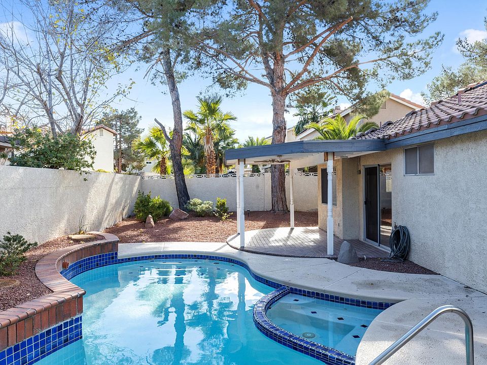 Gorgeous backyard with pool, spa, covered patio, and low maintenance landscaping.