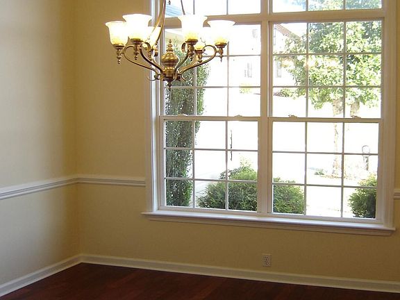 Asian Piyankado floors, Trey ceiling, and a beautiful chandelier.