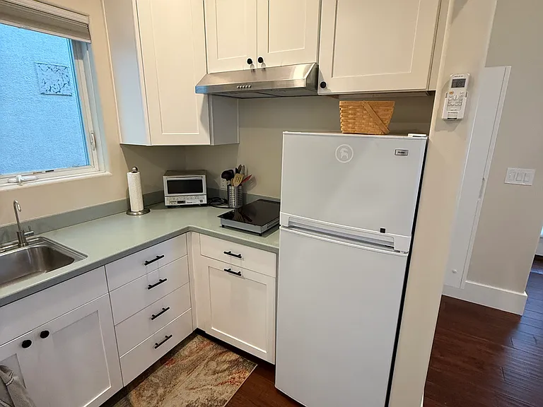 Kitchenette (note, stove top shown now embedded in counter)