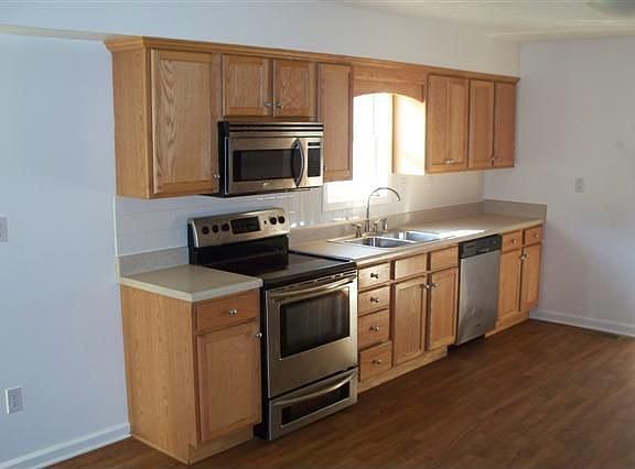 One side of kitchen- other side has stainless refrigerator and cabinets