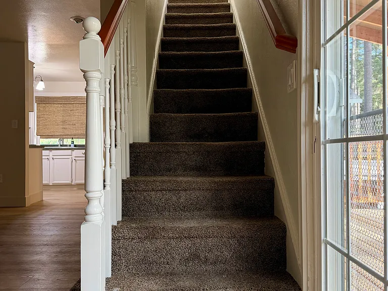 Stairway leading to the upstairs bedrooms and bathroom