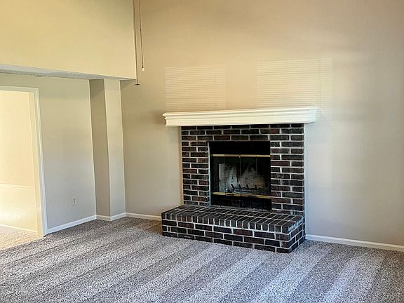 Living Room from Stairs, Gas FP and Ceiling Fan, open to dining room on the left