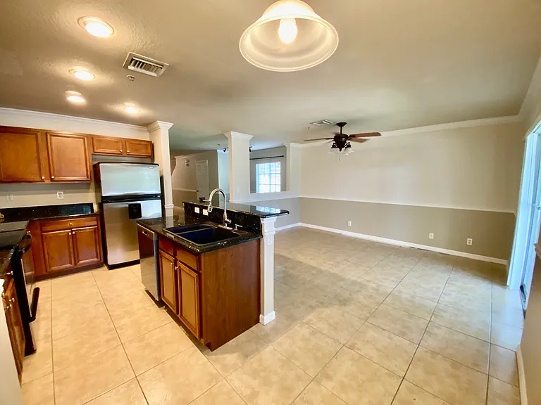 Kitchen, island, nook, living area and access to patio and yard.