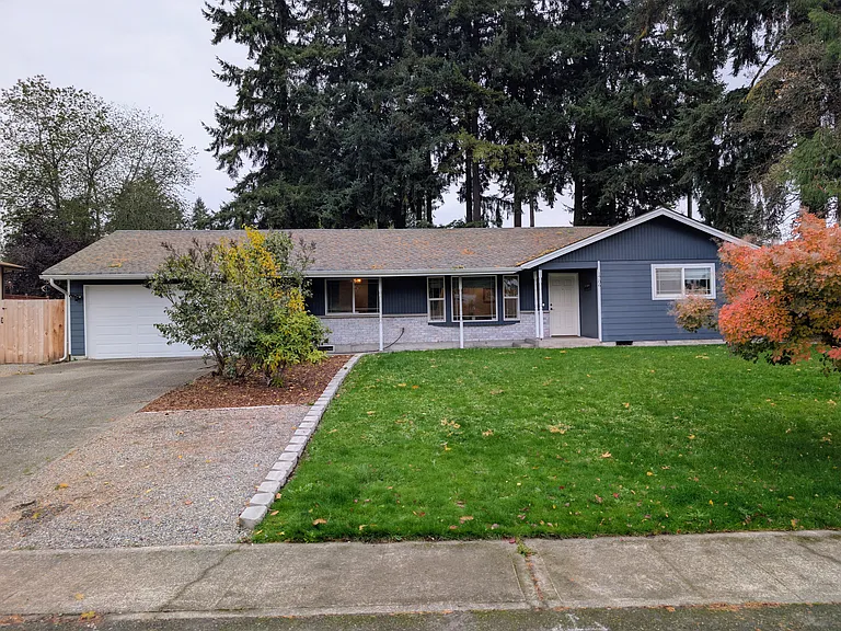 Fresh landscaping and large front windows