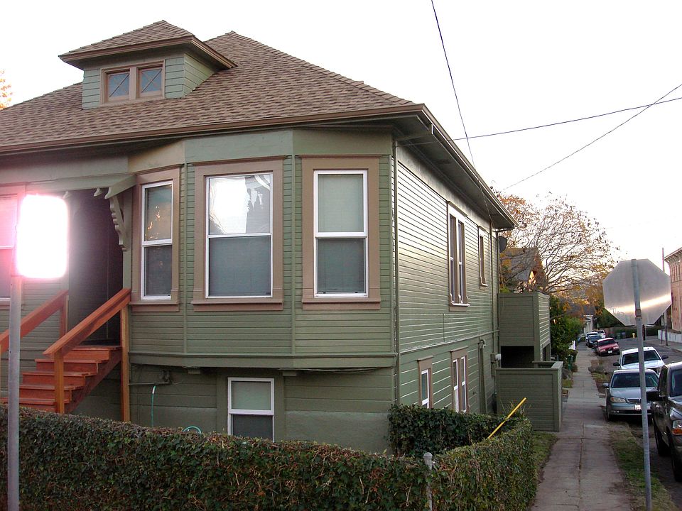 Main house apartments are on the Walnut St. side of the house by the carport