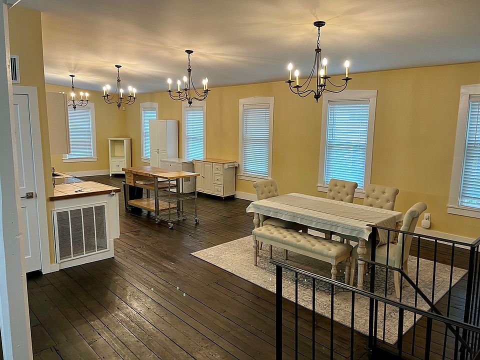 Dining Area Pic 1 (Stairwell is on the left and the kitchen area is on the right)