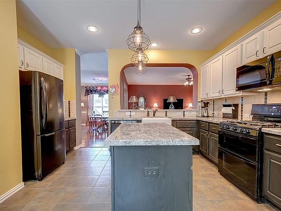 The farmhouse sink, double ovens, pull out shelves in the bottom cabinets, recent dishwasher, and island with storage are what makes this kitchen so functional. What you can't see is the huge walk-in pantry just off to the left. Come see for yourself