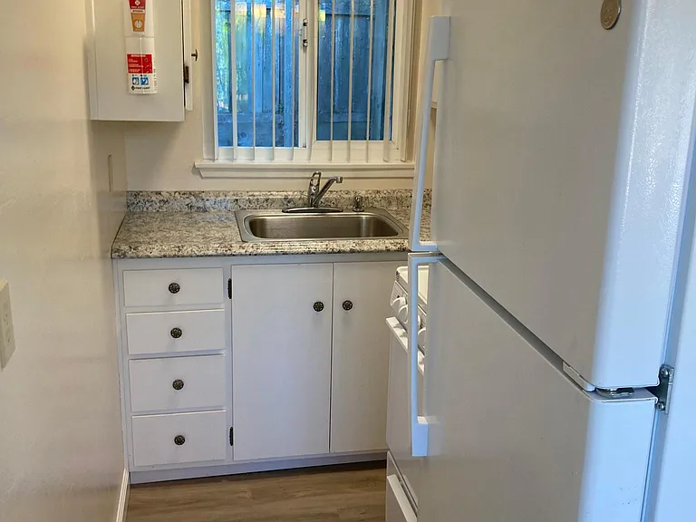 Kitchen, stove and refrigerator. Ample cabinetry