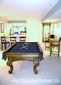 Walk Out Lower Level Rec Room : Includes rec room, bar, 2 bedrooms, 1 full bath, storage room.