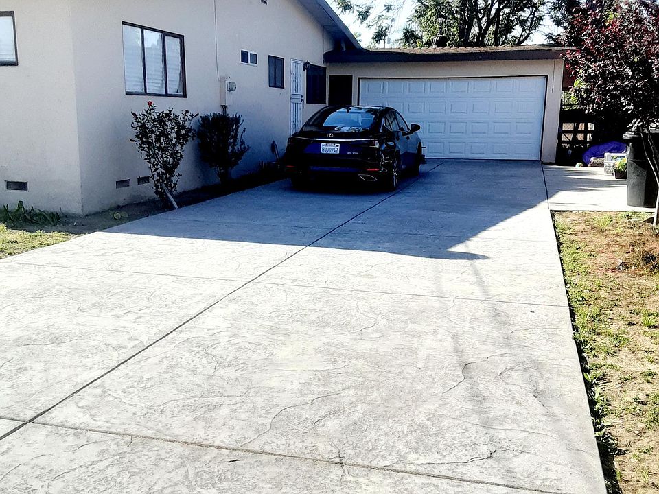 Driveway just got done weeks ago. Stamped with built in umbrella holders so theres no need to rent a canopy for partys.