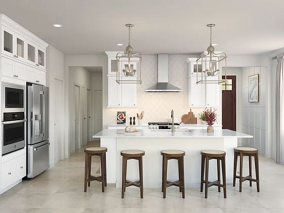 Kitchen with pendant lighting and glass upper cabinets