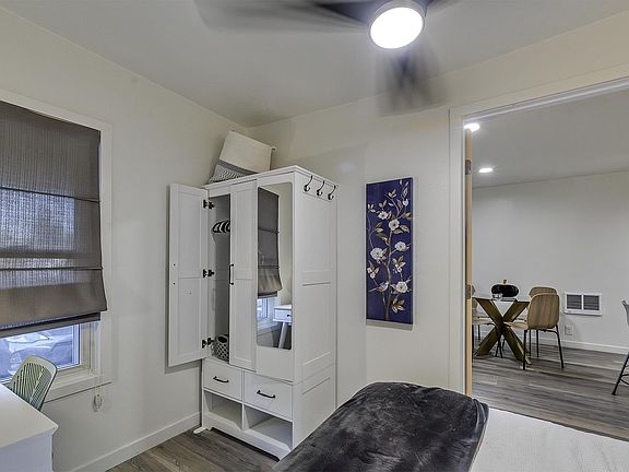 Closet for hanging cloths with shelving + full mirror