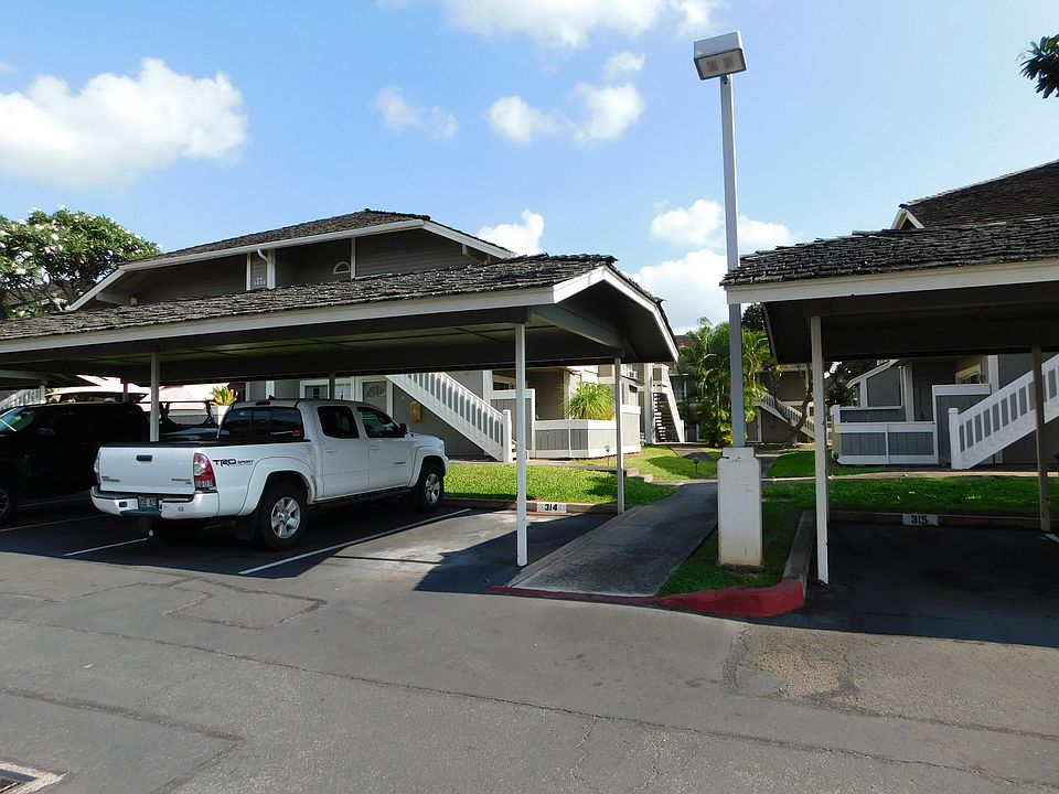 TWO ASSIGNED COVERED PARKING STALLS. One is right next to the sidewalk to the rental unit.