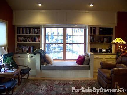 Living room built-ins
						:
						Bookshelves, cabinets and a twin-size window seat for afternoon reading