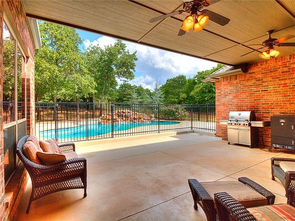 Large covered patio next to the pool is perfect for entertaining.