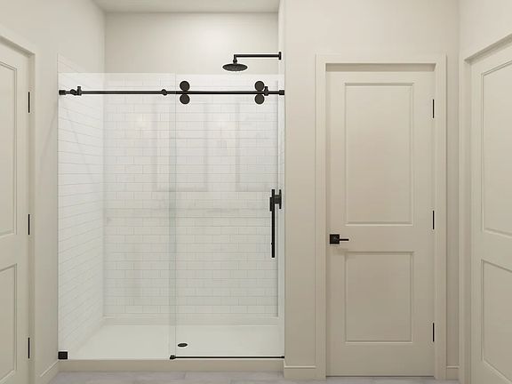 Primary bath with glass shower enclosure