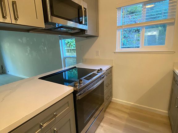 new stove and microwave, pass through view to the family room.