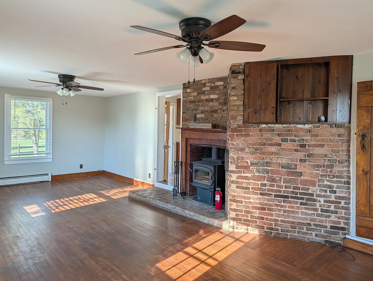 Living room with working wood burning stove - 60 Clerico Ln #2