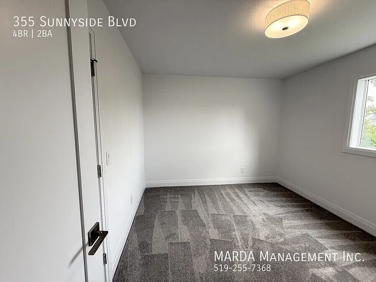 355 Sunnyside Blvd — Photo 28