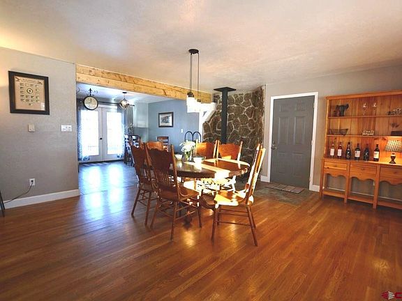 Wood stove, open concept to kitchen/breakfast area.