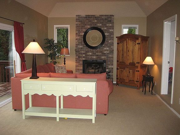 Family Room with Gas Fireplace and HUGE bonus room attached with glass door. 