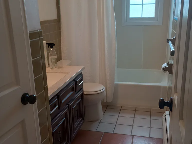 Large bathroom with shower-tub and linen closet