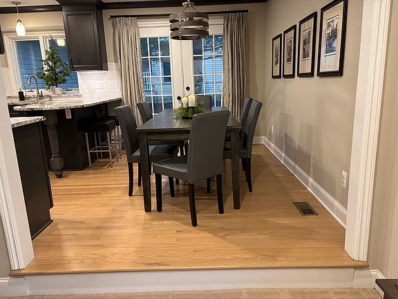 Dining area and barstool seating with patio door to stamped concrete patio