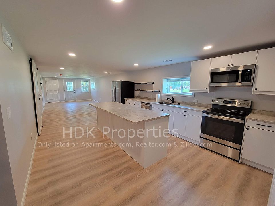 Kitchen facing living room and front door