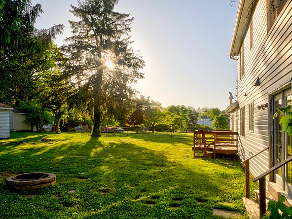 Comfortable backyard with fire pit and deck