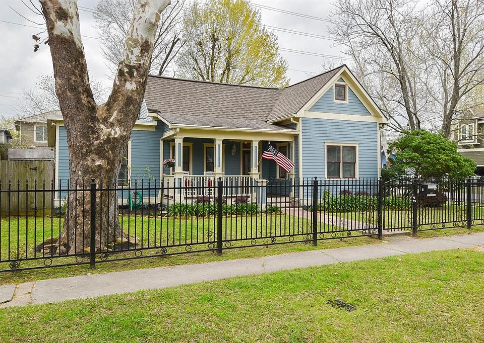 Charming Heights bungalow surrounded by rod iron fence enclosing the front yard. Additional street parking provided just outside the front gate.