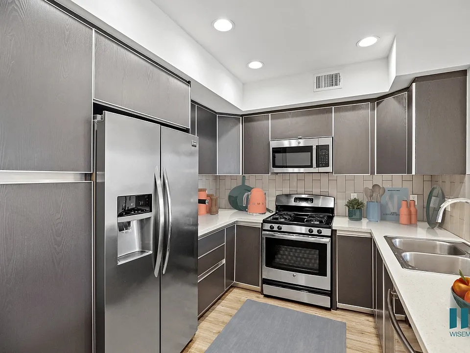 Full-Size Kitchen with Stainless Steel Refrigerator, Stove, Microwave Oven, and Dishwasher