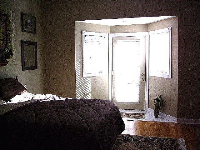 Main level bedroom opens up to back yard