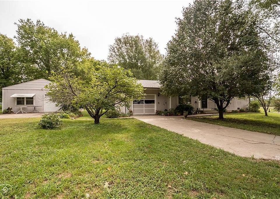 Front picture of the home.  The lot has so many mature trees sitting on it!