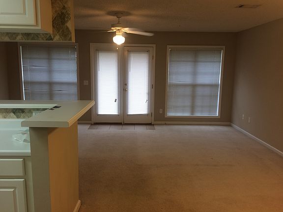 Large living area with access to the backyard